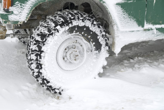 travelstar all terrain tire in snow in winter closeup