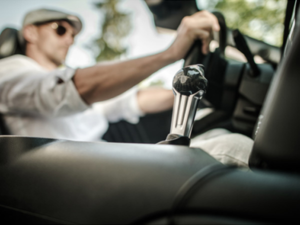 a man is driving an jeep wranglers that include automatic engine