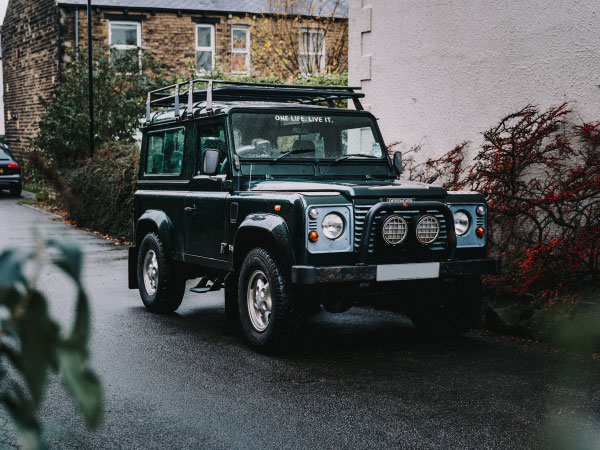 black Jeep Wrangler on park beside road