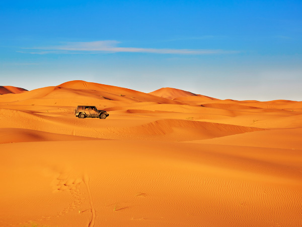 A jeep Sahara in sand dunes