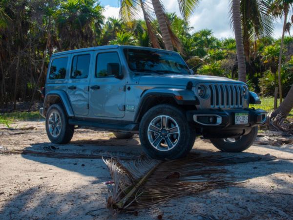 a beautiful jeep wrangler parking on the street