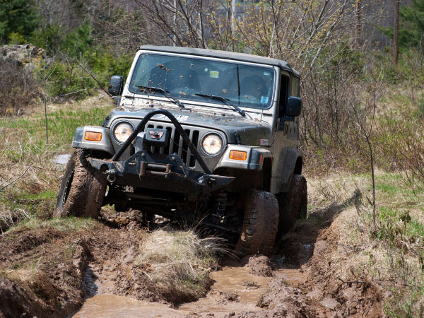 Jeep Wrangler Off-Road on Muddy Trail