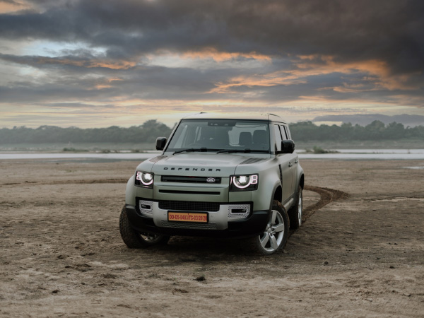 a beautiful jeep wrangler sport on sand