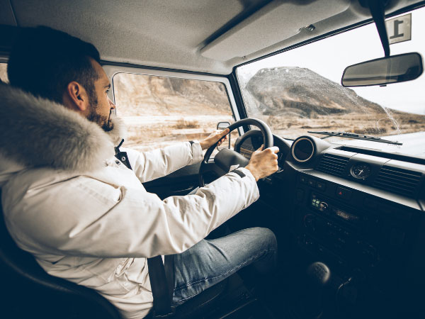 a man driving his Jeep wrangler on the Icelandic roads