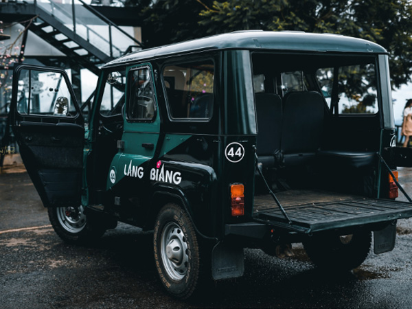 green and black jeep wrangler with hard top