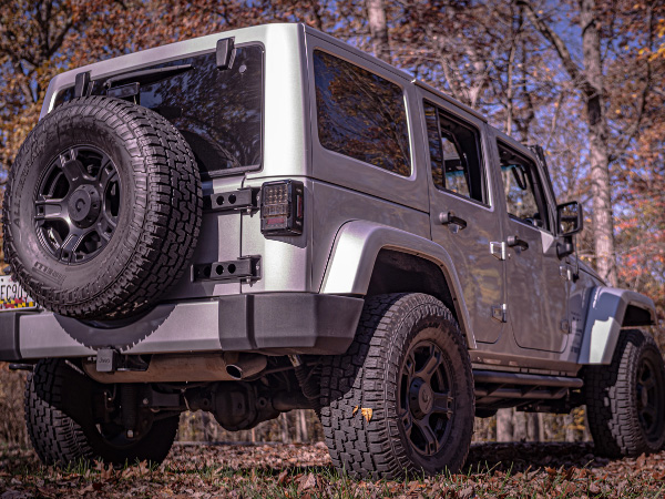 white and black jeep wrangler with Smittybilt rear bumper