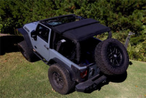 Jeep with a black soft top